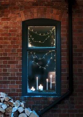 Christmas20 - Candles through window