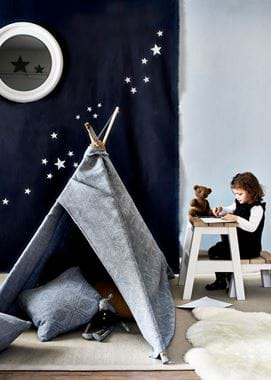 Playroom teepee with child