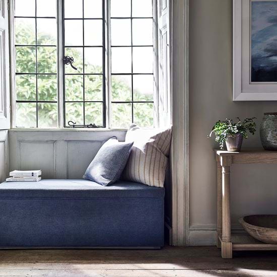 Eloise ottoman in window