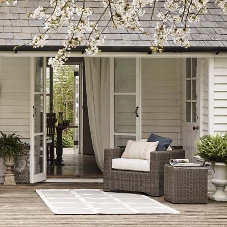 Burford rug on decking outside summer house