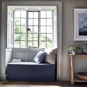 Eloise ottoman in window